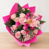 Bouquet of pink roses wrapped in bright pink paper