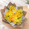 Yellow roses and alstroemeria bouquet wrapped in brown paper