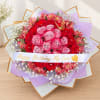 Bouquet of red and pink roses with a birthday ribbon
