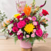 Colorful mixed bouquet in a pink vase with a Happy Birthday topper
