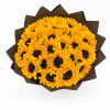 Bouquet of yellow sunflowers wrapped in dark paper