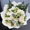 Bouquet of white roses and white chrysanthemums with greenery in white paper