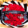 Bouquet of red roses with black ribbon and butterfly decorations