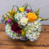 Mixed bouquet with hydrangeas, roses, and carnations in a vase