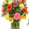 Colorful mixed bouquet in a clear glass vase