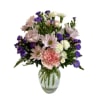 Pink and purple mixed bouquet in a clear glass vase