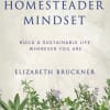 Book cover with the title The Homesteader Mindset and herbs at the bottom