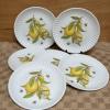 Set of white paper plates with lemon and bee designs