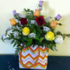 Mixed roses in a chevron-patterned tote bag