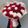 This handcrafted rose bouquet is full of fresh red and white roses.