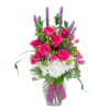A bright and bold, plentiful combination of gorgeous pink roses and spray