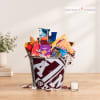 Candy gift bucket in an A&M tin with assorted snack packs