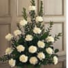 White pompom flowers arranged in a wicker basket
