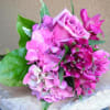 Pink rose and hydrangea bouquet with green leaves