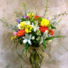 Colorful mixed flower bouquet in a glass vase