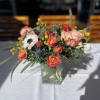 Mixed bouquet of roses and anemones in a clear glass vase