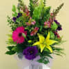Bright mix with non-fragrant lillies in standard vase. 
(14"w x 22"h)