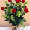 Dozen roses with Bells of Ireland in standard vase