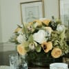 Elegant centerpiece feutiring Yellow callas, yellow roses , white roses, green hydrangeas