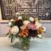 Lynette peach cremones, vendela ivory roses, butterscotch daisy's, white mini carnations, antique