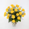 Yellow roses arranged in a clear glass vase