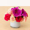 A perfect design of roses and spray roses in varying shades of