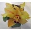 Yellow orchid arrangement in a square glass vase