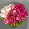 Bouquet of pink and pale blush roses in a round arrangement