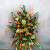 Tall tropical arrangement with roses, hydrangeas, and orange bird-of-paradise flowers