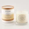Two October birth flower candles, one in a box and one in a glass jar