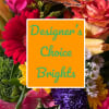 Bright mixed bouquet with gerbera daisies and roses behind a sign