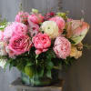 The most luxurious blooms in low clear vase. Filled with peonies, roses