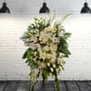Large white floral standing spray with lilies and roses