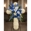 Blue and white funeral spray on a stand with lilies and roses