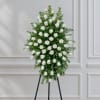 White rose standing spray on a black easel