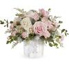 Pink and white rose arrangement in a mosaic ceramic vase