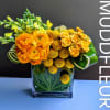 This petit vase is overflowing with a summer mix of fine flowers.