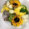 Abstract arrangement featuring beautiful sunflowers and roses. 