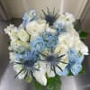Blue and white bouquet with spiky thistle-like blooms