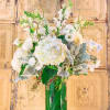 White floral arrangement in a clear glass vase