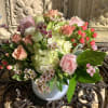 Pink and white rose bouquet in a white vase