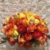 Bouquet of orange and red roses with yellow orchids