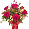 Bouquet of hot pink roses with baby's breath in a vase