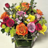A Beautiful assortment of roses and spray roses combined with colorful fillers