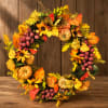 Autumn wreath with sunflowers, pumpkins, and colorful leaves