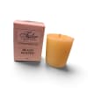 Pink boxed votive candle beside a yellow candle