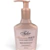Pink pump bottle of hand lotion with a labeled front