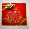 Red Godiva chocolate gift box with gold ribbon
