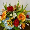 Mixed bouquet with red roses, orange gerbera daisies, and blue hydrangea