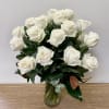 Bouquet of white roses in a glass vase
